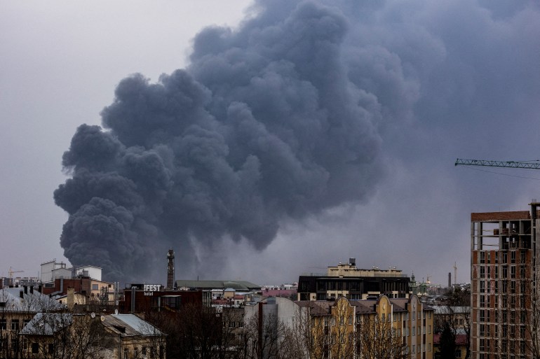 Smoke rises after an air strike, as Russia's attack on Ukraine continues in Lviv.