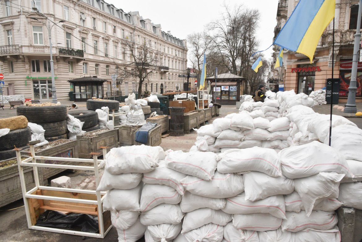 Sandbag barricades are constructed as part of defense preparations