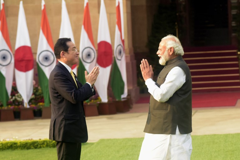 Indian Prime Minister Narendra Modi welcomes his Japanese counterpart, Fumio Kishida, before their meeting in New Delhi