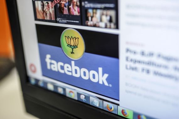 Logos for the BJP and Facebook are displayed on a computer in India
