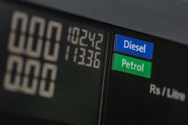 Fuel prices displayed at a pump in Mumbai [File: Dhiraj Singh/Bloomberg]