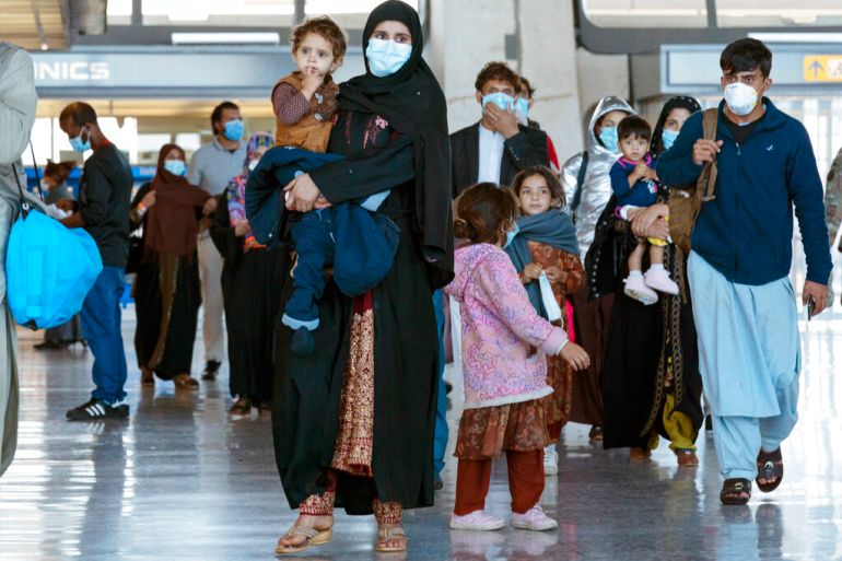 Afghan families arrive at airport in US