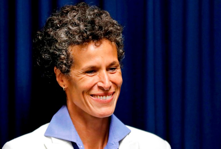 Bill Cosby accuser Andrea Constand smiles as she listens during a news conference after Cosby was found guilty in his sexual assault retrial in Norristown, Pennsylvania, in 2018.
