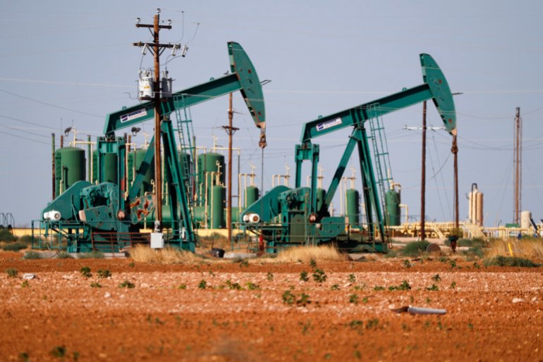a view of a pump jack operating in an oil field in Midland, Texas. 