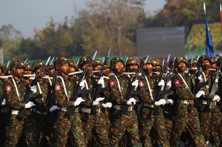 Soldiers march with bayonets during a ceremony to mark Myanmar Union Day in February