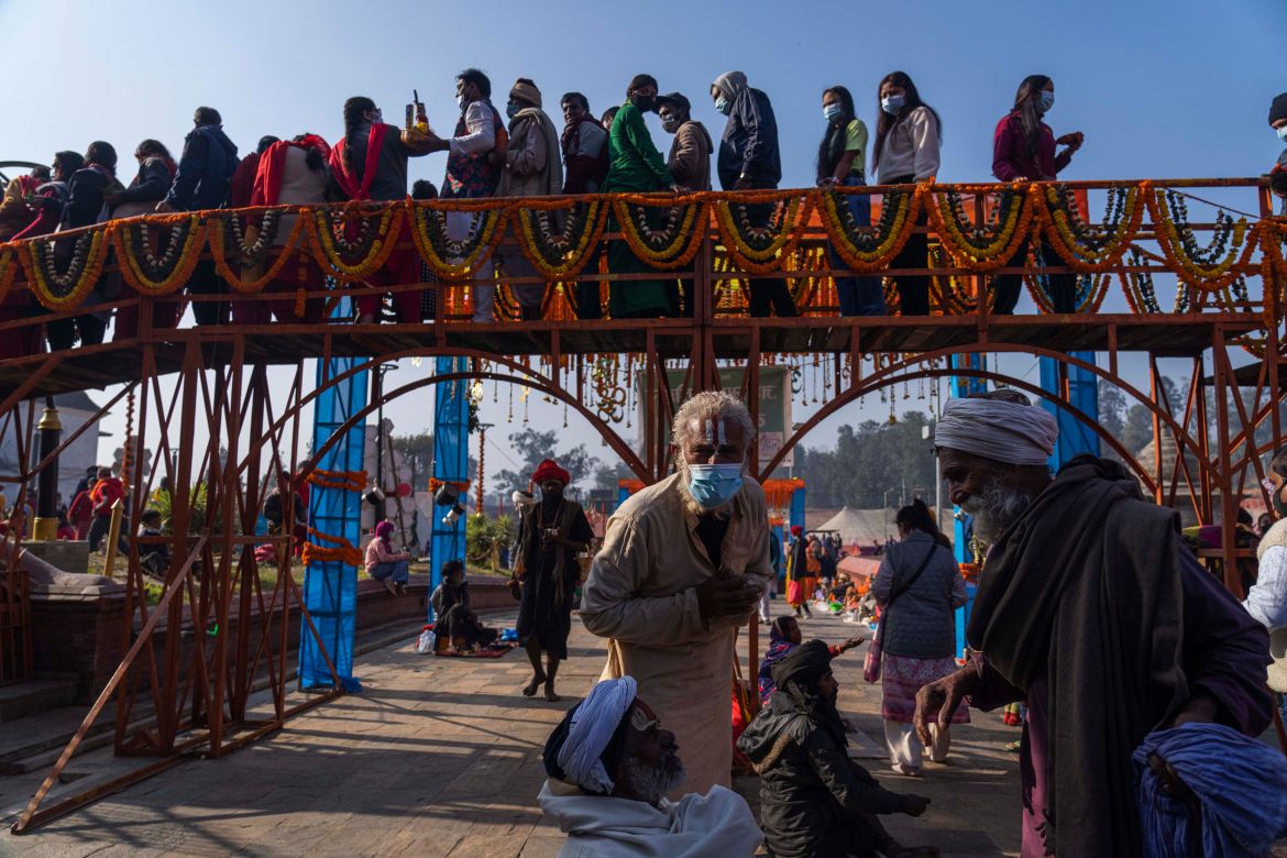 Devotees stand in a queue to enter the Pashupatinath Hindu temple