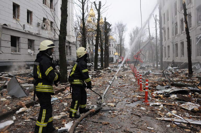 Firefighters extinguish a building of Ukrainian Security Service (SBU) after a rocket attack in Kharkiv, Ukraine's second-largest city, Ukraine