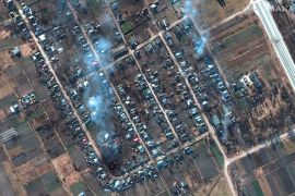 This satellite image provided by Maxar Technologies shows a closer view of burning homes and impact craters in a field in Rivnopillya, Ukraine on Feb. 28, 2022. (Satellite image ©2022 Maxar Technologies via AP)