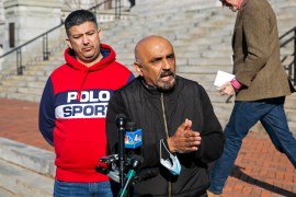 Roger Verma, an American franchise owner of a Newark Lukoil gas station, speaks to the media outside city hall in Newark, New Jersey