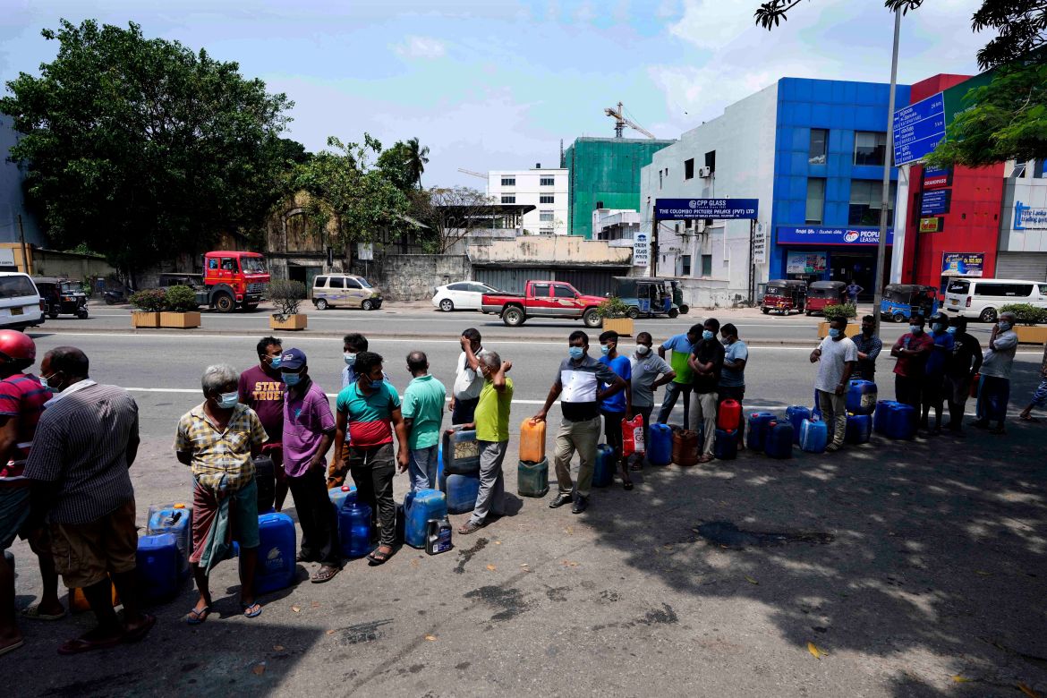 Sri Lankans queue up to buy diesel at a fuel station in Colombo
