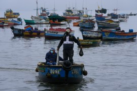 Fishermen at sea after oil spill