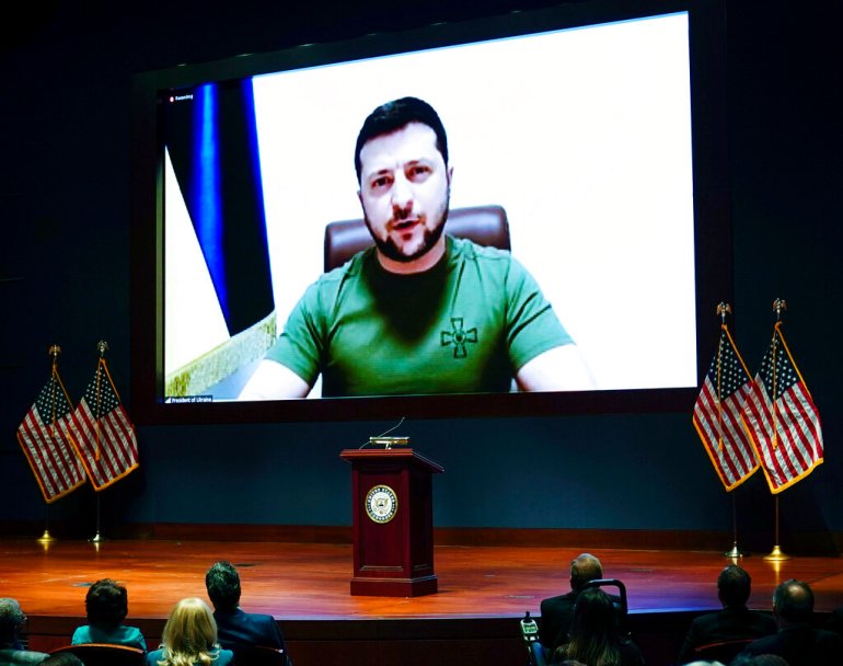 Ukrainian President Volodymyr Zelenskyy delivers a virtual address to Congress by video at the Capitol in Washington.