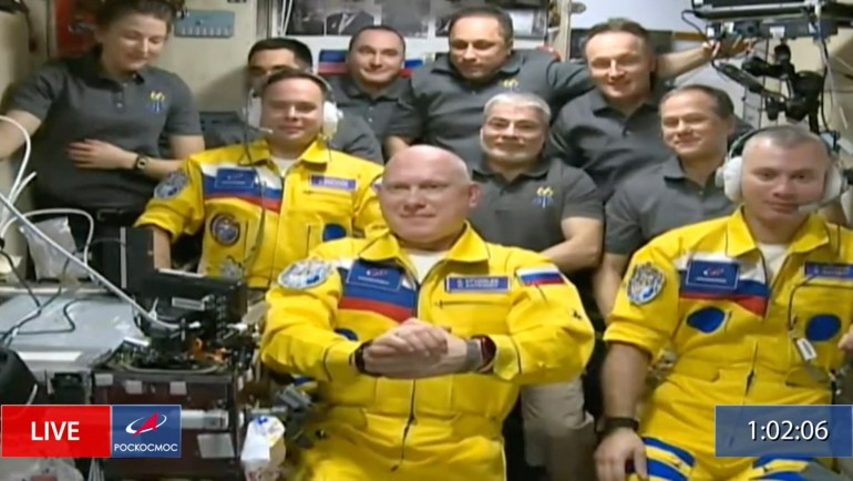 In this frame grab from video provided by Roscosmos, Russian cosmonauts Sergey Korsakov, Oleg Artemyev and Denis Matveyev are seen during a welcome ceremony after arriving at the International Space Station, Friday, March 18, 2022, the first new faces in space since the start of Russia’s war in Ukraine. 