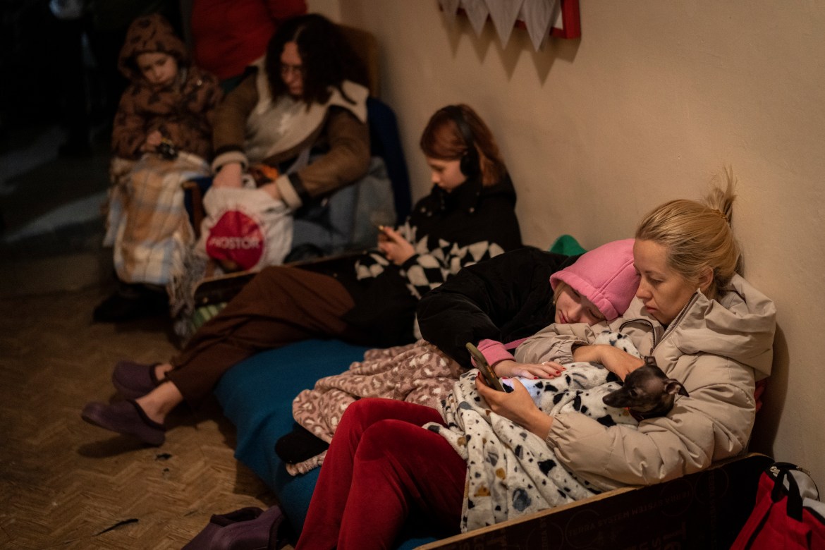 A displaced household  from Kyiv, right, beryllium   successful  a basement, utilized  arsenic  a weaponry  shelter