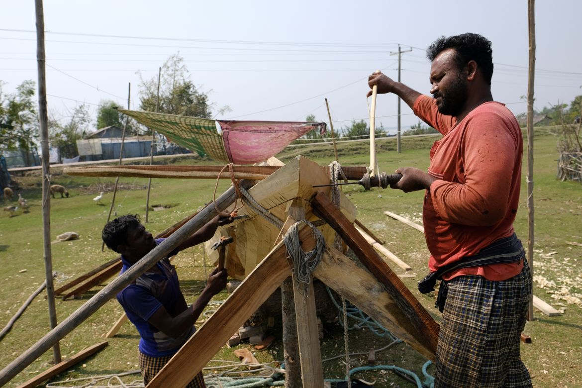 Craftsmen build a fishing boat at Chila Bazar, in Mongla, Bangladesh