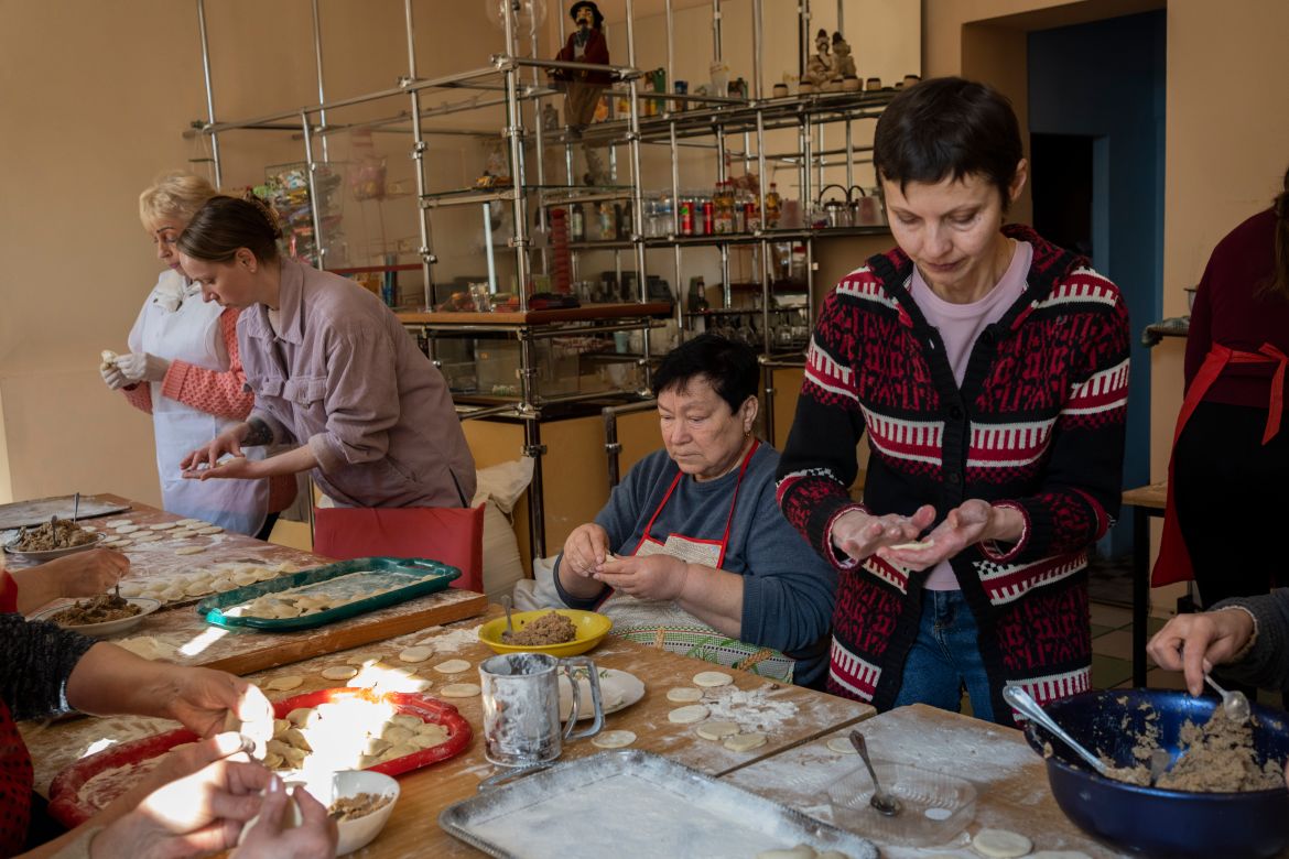 Volunteers prepare varenyky, stuffed dumplings, inside a theatre in the city of Drohobych