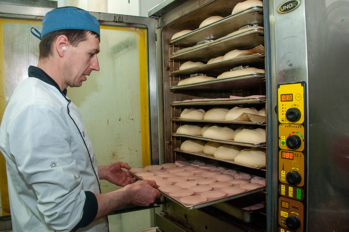 A volunteer bakes bread for Ukrainian servicemen in Kharkiv