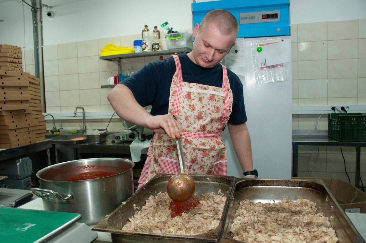A volunteer cooks food for Ukrainian servicemen in Kharkiv
