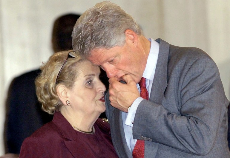 President Bill Clinton confers with US Secretary of State Madeleine Albright