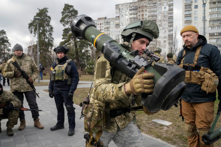 A Ukrainian Territorial Defence Forces member holds an NLAW anti-tank weapon on the outskirts of Kyiv, Ukraine, on March 9, 2022