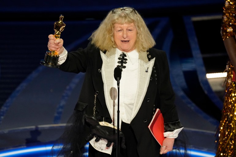 Jenny Beavan accepts the award for Best Costume Design "Cruella" At the Oscars on Sunday, March 27, 2022, at the Dolby Theater in Los Angeles.  (AP Photo/Chris Pizzello)