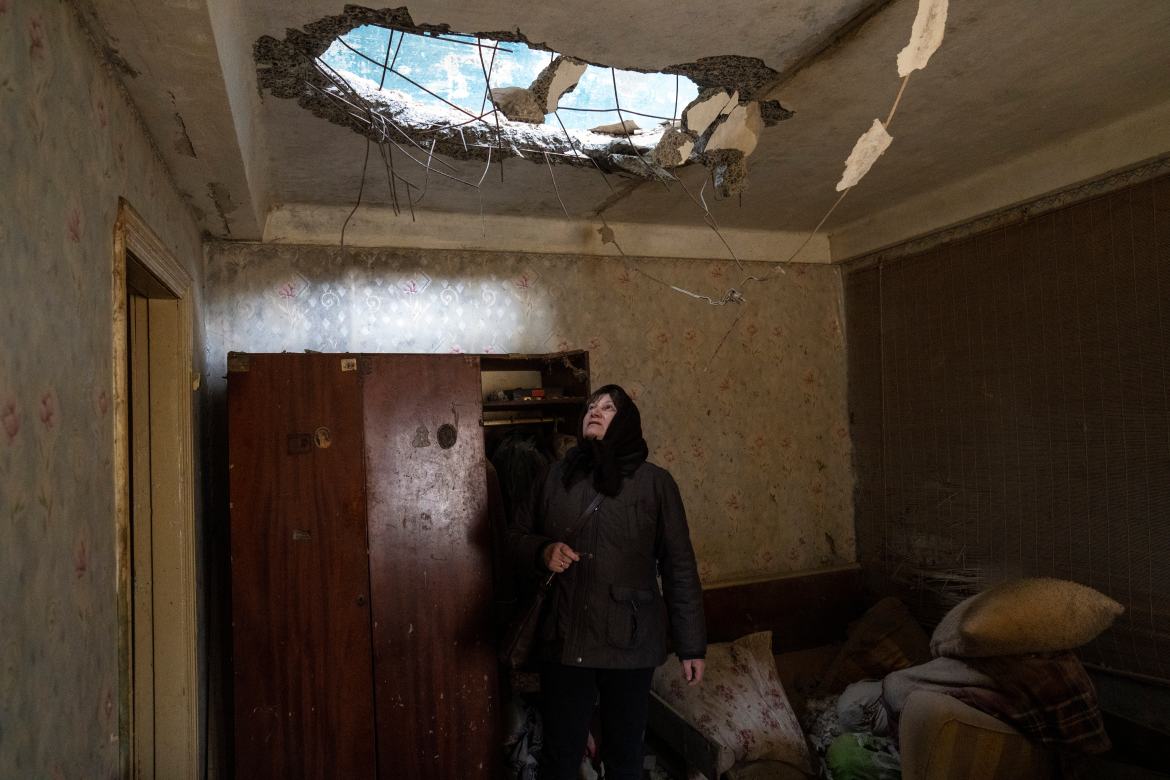 Halyna Falko looks at the destruction caused after a Russian attack inside her house near Brovary
