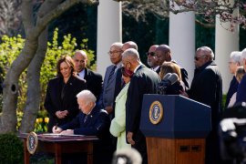 President Joe Biden signs the Emmett Till Anti-Lynching Act in the Rose Garden of the White House.