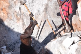 Small-scale miners breaking rocks in Rupa sub-county, Moroto district, Uganda, on 24 November 2021