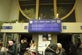 Departure board showing train schedule at Zahony train station, Hungary
