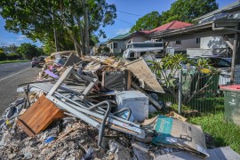 Furniture, electronic goods and personal possessions that were destroyed in the floods piled on the side of a Lismore street
