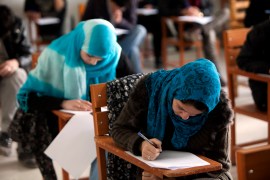 Afghan students seen as they write an exam