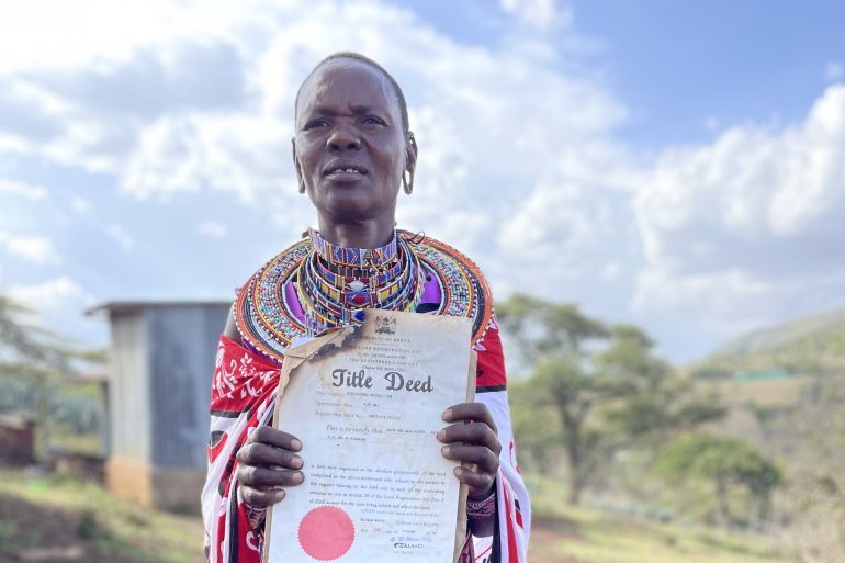 Ipato “Peris” Kateki, a Maasai female landowner, a rarity among her people, holding the title deed to her land