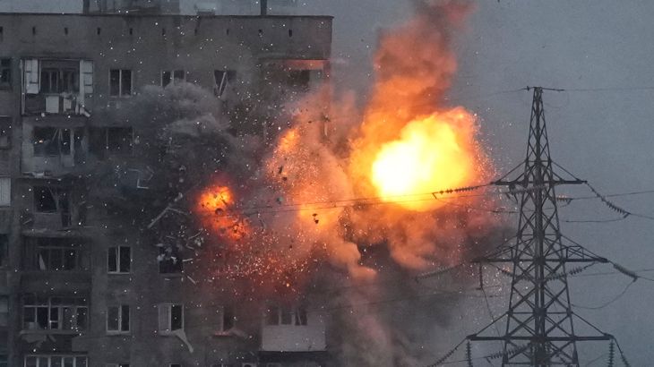 An explosion in an apartment building that came under fire from a Russian army tank in Mariupol