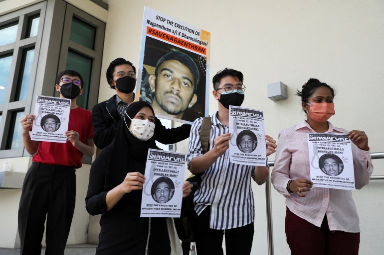 Activists protest with signs against death penalty