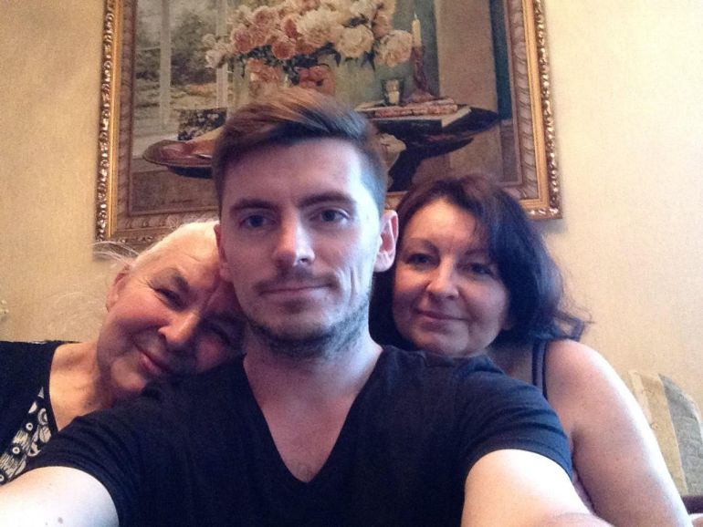Roman Skliarov with his grandmother (left) and mother (right).