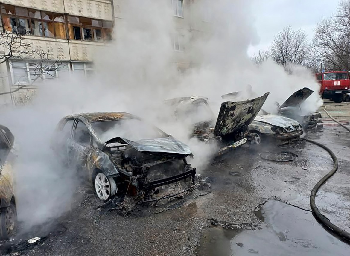 A handout photo made available by the Ukraine State Emergency Service press service shows a view of burnt vehicles after shelling at a residential area in Kharkiv