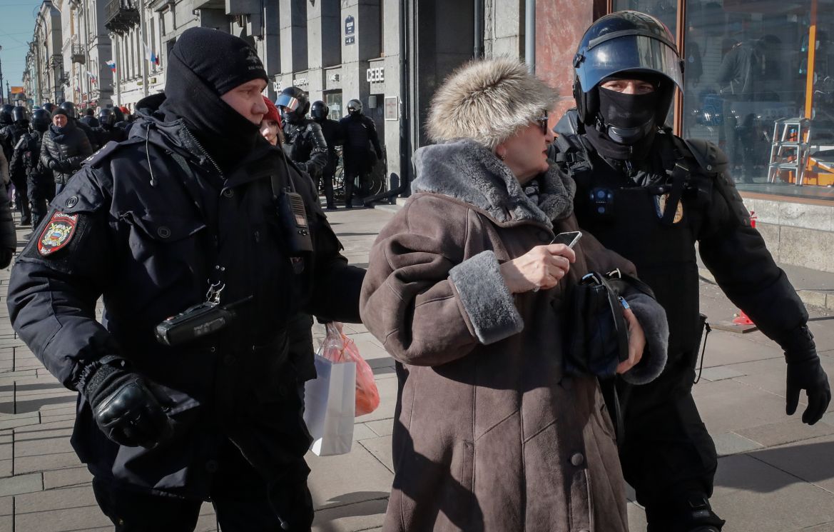 Russian policemen arrest a participant in an unauthorized rally against the Russian special operation in Ukraine, in Saint Petersburg,