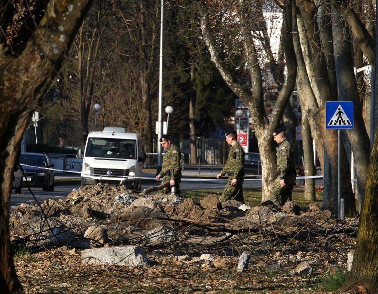 Croatian soldiers investigate the site where a military drone crashed in Zagreb