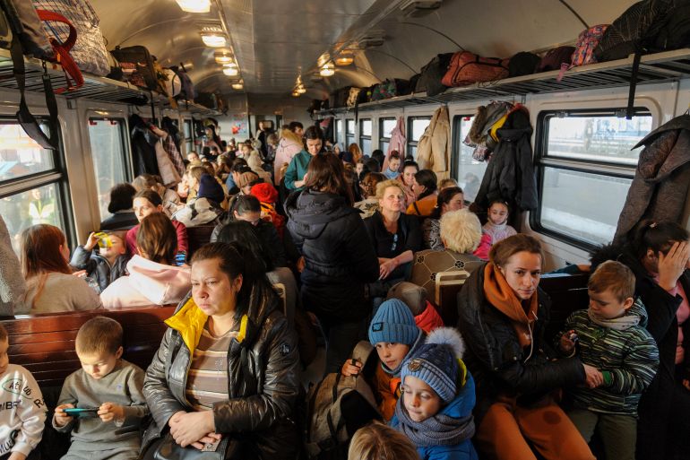 Ukrainian refugees depart to Poland.
