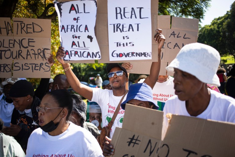 People take to the streets during a rally organized by the Kopanang Africa against Xenophobia organization, calling for an end to 'xenophobic sentiments and groups' in Johannesburg