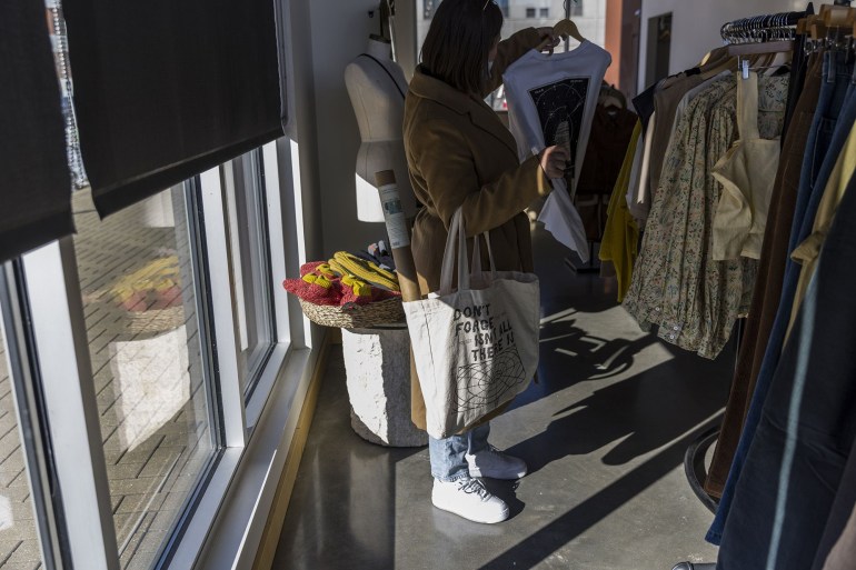 A shopper inside a women's clothing store in the East Village neighborhood of Des Moines, Iowa