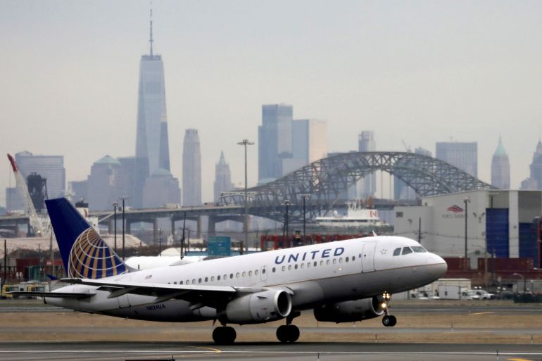 A United Airlines passenger jet takes off with New York City