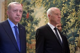 Tunisian President Kais Saied arrives with Turkish President Recep Tayyip Erdogan for a joint press conference at the presidential palace in Carthage.