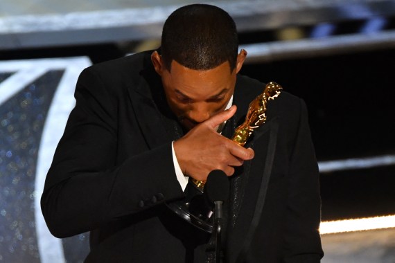 Will Smith weeps as he collects his Oscar