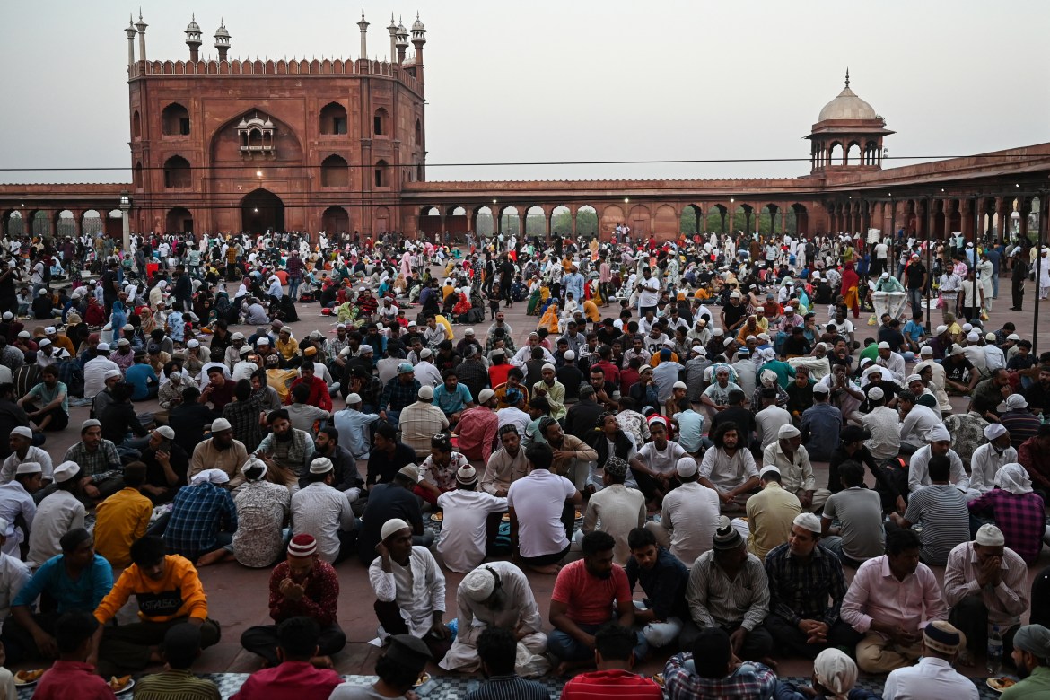 Muslim devotees break their fast at the Jama Masjid Mosque on the first day of the holy fasting month of Ramadan