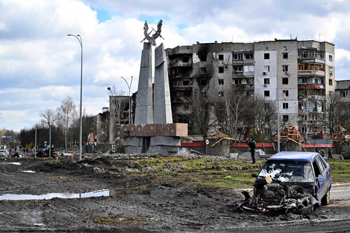 The wreckage of a car is seen at the central square of Borodianka