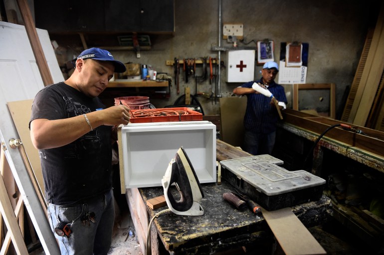 Carpenter Jose Macias, 32, works at a workshop in the Huichapan neighborhood