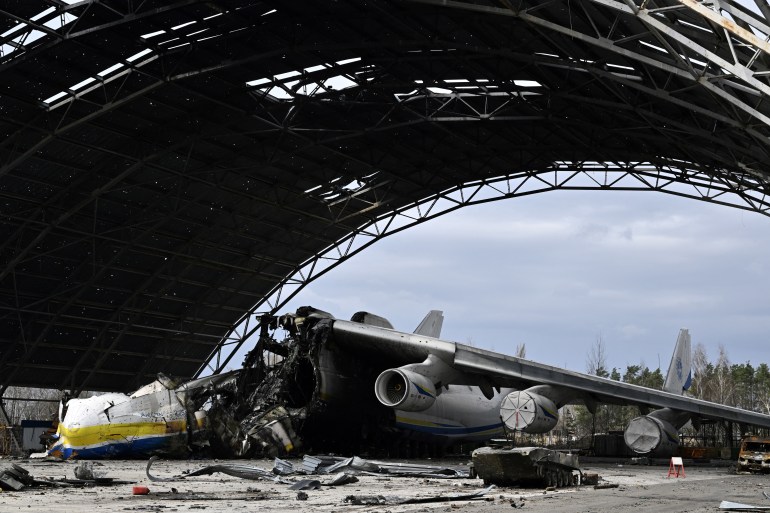A picture shows the destroyed Ukrainian Antonov An-225 "Mriya" cargo aircraft, which was the largest plane in the world, at the Gostomel airfield
