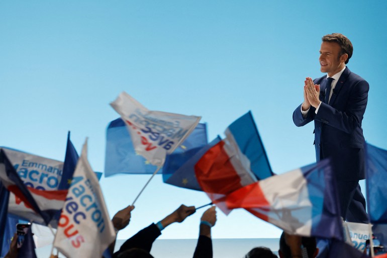 French President and party candidate Emmanuel Macron gestures to supporters at Paris Expo Porte de Versailles Hall 