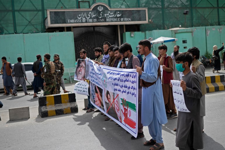 Afghan protestors take part in a protest against the alleged published reports of harassment of Afghan refugees in Iran, in front of the Iranian embassy in Kabul 